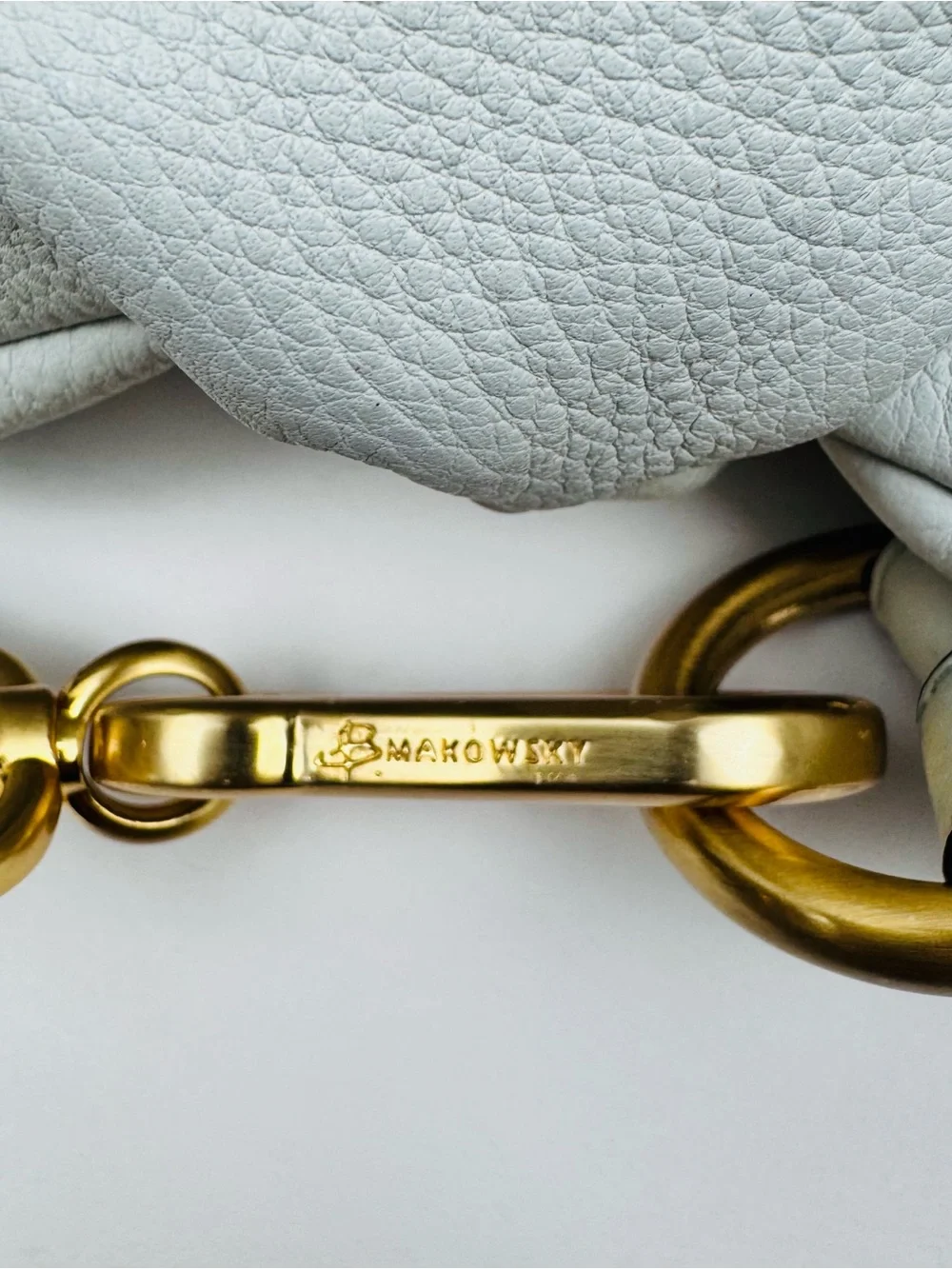 B. Makowsky Leather Ivory Hobo handbag. Gold-tone stud accent hardware.
